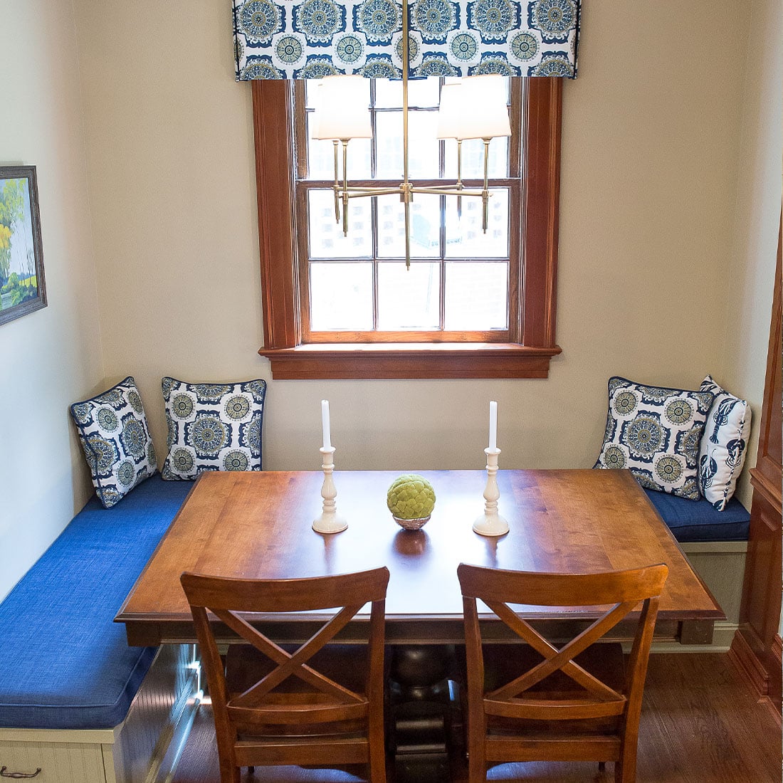 Blue cushioned breakfast nook in renovated kitchen
