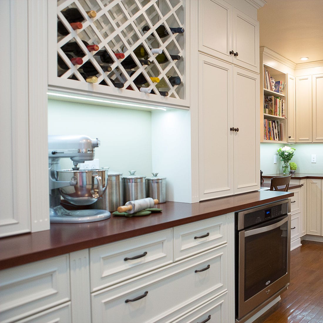 Built in storage nook with wine rack in renovated kitchen