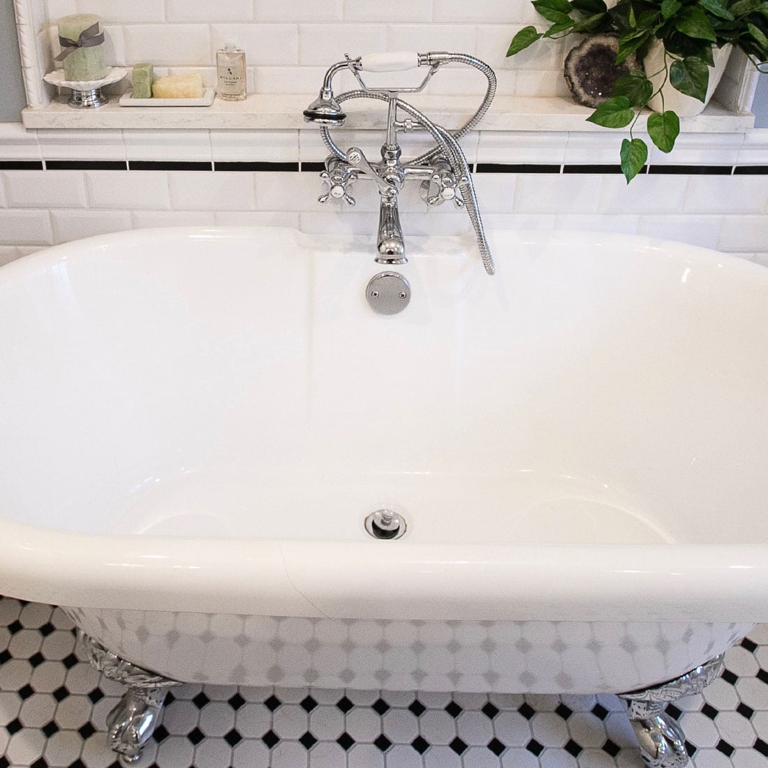 White clawfoot tub in renovated bath