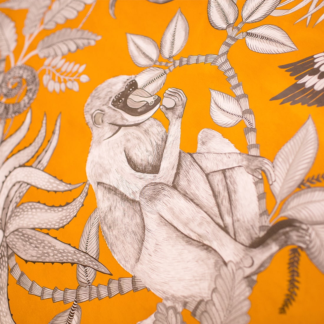 Orange wall paper with monkey detail in renovated bath
